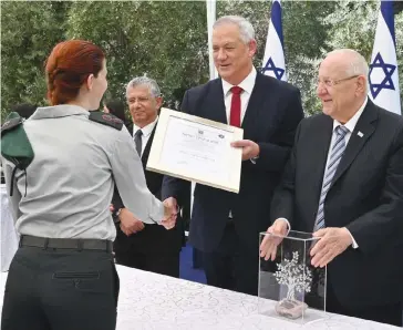  ?? (Defense Ministry) ?? PRESIDENT REUVEN Rivlin and Defense Minister Benny Gantz award the Israel Security Prize at the President’s Residence on Monday.