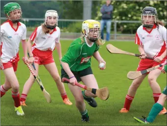  ??  ?? Rebecca Ogilvie of Clonroche spots a gap in the Kilanerin defence.