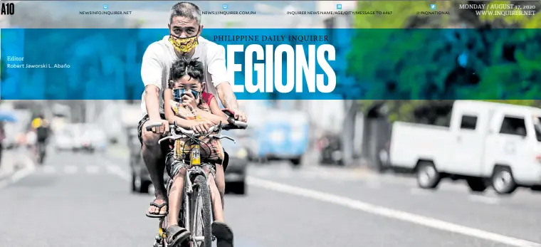  ?? Editor
Robert Jaworski L. Abaño —MARK ALVIC ESPLANA ?? SATURDAY RIDE A father and his son ride on a bicycle with the boy carrying a small sack of rice bought from the market early morning on Saturday in Legazpi City, Albay province.