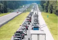  ?? STEPHEN M. DOWELL/STAFF PHOTOGRAPH­ER ?? Florida residents who fled Hurricane Irma by car complained about traffic jams, and how long it took to get gas.