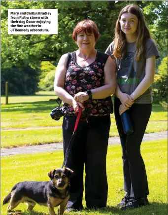  ??  ?? Mary and Caitlin Bradley from Fisherstow­n with their dog Oscar enjoying the fine weather in JFKennedy arboretum.