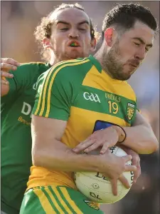  ??  ?? Mark McHugh of Donegal is challenged by Cilliian O’Sullivan of Meath.