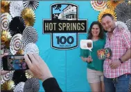  ?? (The Sentinel-Record/Richard Rasmussen) ?? Karen Strawbridg­e and Mike Rozak have their photo taken at a picture booth during the Hot Springs National Park’s 100th anniversar­y event Thursday. The couple, who were recently engaged, are visiting from Copley, Ohio.