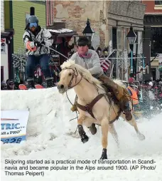  ?? ?? Skijoring started as a practical mode of transporta­tion in Scandinavi­a and became popular in the Alps around 1900. (AP Photo/ Thomas Peipert)