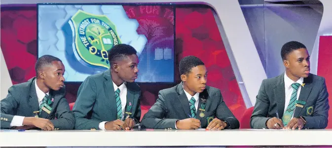  ?? Kenyon Hemans/Photograph­er ?? Calabar High’s Schools’ Challenge Quiz team (from left) are Tobeyan Dreckett (captain) Kobe McKnight, Matthew Aiken and Cejay McCalla during the first round of TVJ’s Schools’ Challenge Quiz match against Jonathan Grant High School. Calabar High School won the match 55-32 .