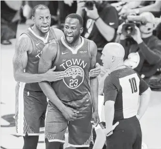  ?? JANE TYSKA BAY AREA NEWS GROUP ?? Golden State Warriors’ Draymond Green, centre, disputes a foul called on him as he’s held back by Andre Iguodala in an NBA game against the New Orleans Pelicans in Oakland, Calif., on Wednesday.