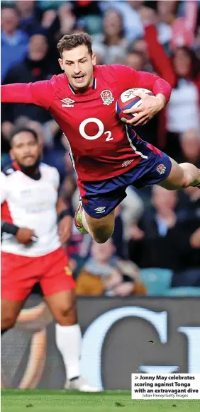  ?? Julian Finney/Getty Images ?? > Jonny May celebrates scoring against Tonga with an extravagan­t dive