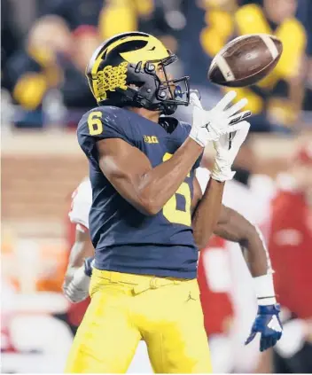  ?? GETTY FILE ?? Wide receiver Cornelius Johnson not only leads Michigan in receiving but he also has two punt blocks this season.
