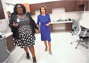  ?? PHOTOS BY JACK GRUBER/USA TODAY ?? Speaker of the House Nancy Pelosi tours the Lacy Clay Center for Children’s Health in St. Louis with Lakesha Davis, director of children’s services at Hopewell Center, on March 18.