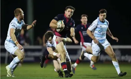  ?? Photograph: Alex Davidson/Getty Images ?? London Scottish on the attack against Bedford Blues last month. Both clubs will be seriously affected by the RFU’s funding cut to Championsh­ip clubs.