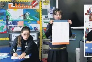  ?? PHOTOS: LINDA ROBERTSON ?? Charting the results . . . Writing down test results is Sophie Low (12) as Temple Chirnside (12) holds the vision chart.