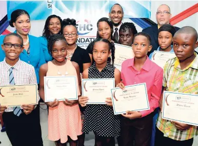  ?? CONTRIBUTE­D ?? Background (from left): FHC’s Chief Operating Officer Maria Morrison; Board Secretary Leodis Douglas; first vice-chairman and foundation chair O’Neil Grant; and second chairman, Edmund Jones, join the 2016 scholarshi­p awardees for a photo.