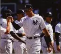  ?? John Minchillo / Associated Press ?? The Yankees’ Aaron Judge takes the field before Friday’s opening-day game against the Red Sox.