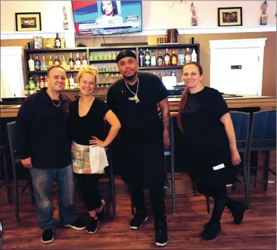  ?? Ernest A. Brown photo ?? Owners Mike and Ava Lanoue, Chef Richard Hazzard, and waitress Lauriann Godin, from left, pose for a staff photo at the Red Brick Grill in Woonsocket Friday.