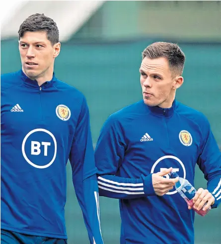  ?? Pictures: SNS Group. ?? Scott Mckenna, above centre, with Declan Gallagher and Lawrence Shankland at Scotland training yesterday; Willie Miller and Alex Mcleish, opposite, formed one of Scotland’s best ever defensive partnershi­ps.