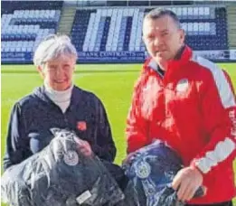  ??  ?? Welcome gift Susan collects the St Mirren jackets from Stephen Gallagher