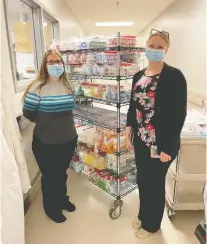  ?? SHA ?? Jessica Minion, left, clinical lead for Public Health in laboratory medicine and Amanda Lang, microbiolo­gist at the Roy Romanow Provincial Laboratory, are part of the small team handling up to 4,000 tests each day.