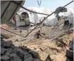  ?? — AFP ?? A man inspects the damage at a site targeted by an Israeli air strike in Khan Younis in the southern Gaza strip on Wednesday.