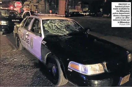  ?? PIcture: EPA ?? PROTEST: A handout picture made available by the Milwaukee police department shows a damaged police car after violence broke out in Milwaukee