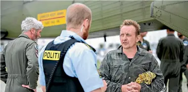  ?? PHOTO: REUTERS ?? Danish submarine owner and inventor Peter Madsen lands after being rescued by the Danish defence in Dragor Harbour south of Copenhagen.