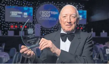  ??  ?? HONOUR: Jock receiving his lifetime achievemen­t award from Scottish Golf in 2017.