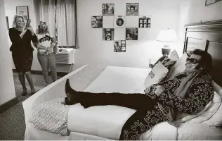  ?? Bob Owen / Staff photograph­er ?? Michael Mcmullen, aka Elvis, poses for photos in the Alcalde Hotel room where Elvis Presley actually spent time before doing a show in Gonzales back in 1955.