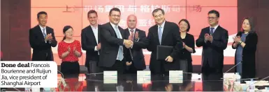  ??  ?? Done deal Francois Bourienne and Ruijun Jia, vice president of Shanghai Airport