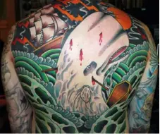  ??  ?? Myke Chambers’ nightmaris­h vision of Moby Dick is part of the rich, long-standing tradition of storytelli­ng in tattoos.