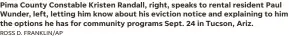  ?? ROSS D. FRANKLIN/AP ?? Pima County Constable Kristen Randall, right, speaks to rental resident Paul Wunder, left, letting him know about his eviction notice and explaining to him the options he has for community programs Sept. 24 in Tucson, Ariz.
