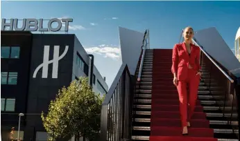  ??  ?? WORLD OF FIRSTS Bar Refaeli, the brand’s first female ambassador, walking down the bridge to commemorat­e the official opening of the second Hublot site