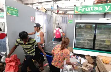  ??  ?? People with goods looted from a store are seen after a protest over a controvers­ial reform to the pension plans of the Nicaraguan Social Security Institute (INSS) in Managua. — Reuters photo