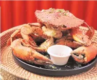  ?? ?? Pink Salt & Black Pepper Crab, one of the new flavors in collaborat­ion with celebrity chef Bruce Lim