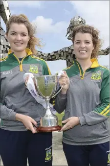  ??  ?? Katie and Orlaith Byrne with the Leinster Intermedia­te Cup at the sponsored walk for the Duleek, Bellewstow­n Ladies Gaelic Football Club at Duleek.