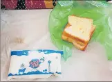  ?? HT PHOTO ?? ▪ Bread served without butter in a polythene packet and 200 ml milk sachet served to a patient at a CHC.