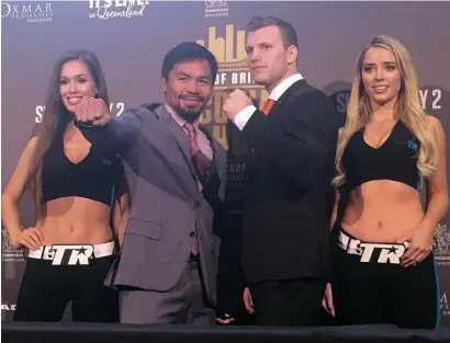  ?? AP ?? Boxers Manny Pacquiao of the Philippine­s (second left) and Jeff Horn of Australia (second right) pose for the photograph­ers in Brisbane on Wednesday. —