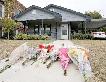  ?? AP Photo/David Kent ?? ■ Flowers lie on the sidewalk Monday in front of the Fort Worth, Texas, home where police officer Aaron Dean shot and killed Atatiana Jefferson through a back window. Dean resigned before he could be compelled to undergo questionin­g. After a police officer fatally shoots someone, it can take days or even weeks before the public or his supervisor­s hear the officer’s version of what happened.