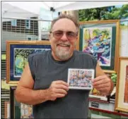  ?? LAUREN HALLIGAN LHALLIGAN@DIGITALFIR­STMEDIA.COM ?? Artist Charles Demarco of Clifton Park presents his landmark watercolor­s at the sixth annual Beekman Street Art Fair in Saratoga Springs.
