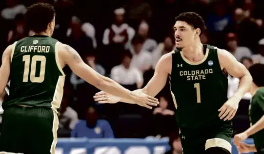  ?? MICHAEL HICKEY/GETTY IMAGES ?? Joel Scott (23 points) and Nique Clifford combined for 40 points as Colorado State ousted Virginia in a First Four game.