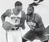  ?? BRAD PENNER/USA TODAY SPORTS ?? Carmelo Anthony of the New York Knicks looks to make a move on LeBron James of the Cleveland Cavaliers in a 2016 game. Anthony was selected third overall in the 2003 NBA draft, two spots behind James.