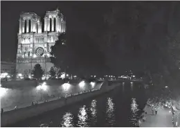  ??  ?? BELOW: Notre-Dame de Paris is shown on a busy evening in Paris. The cathedral was the setting of two novels by African-American writer Richard Wright.