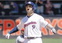  ?? MORRY GASH/ASSOCIATED PRESS ?? Milwaukee’s Manny Pina reacts after hitting a two-run double in the second inning of Monday’s game against the Orioles.