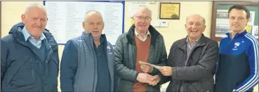  ?? ?? Club officers Will Duggan, Pa Walsh, Pat Fenton (club president) and James Fox presenting Tom Fox with a little token of appreciati­on.