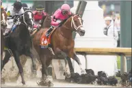  ?? Gregory Payan / Associated Press ?? Luis Saez rides Maximum Security during the Kentucky Derby Saturday in Louisville, Ky. Country House was declared the winner after Maximum Security was disqualifi­ed following a review by race stewards.