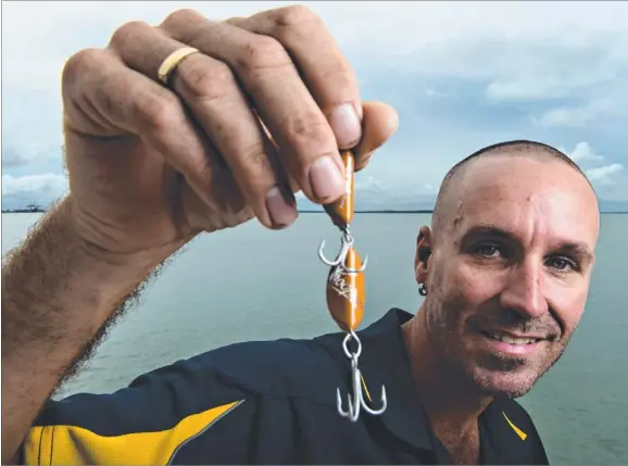  ?? Picture: MICHAEL FRANCHI ?? Daniel VanRas loves fishing so much that he made lures made out of beer caps — and they’ve caught him plenty of fish