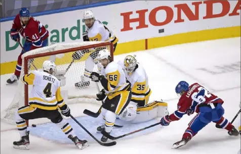  ?? Associated Press ON THE COVER: ?? ABOVE: The goal that ended the season: Montreal’s Artturi Lehkonen, right, beats Tristan Jarry Friday in Toronto. Sidney Crosby after Game 4, then inset are, from left to right: Jim Rutherford, Mike Sullivan, Matt Murray and Evgeni Malkin.