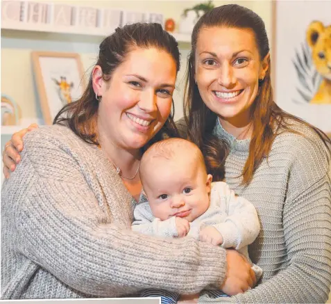  ??  ?? Drysdale couple Annie Perkins and Lyndal Dew welcomed son Charlie this year. Picture: PETER RISTEVSKI