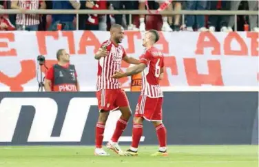  ?? Agence France-presse ?? ↑
Olympiacos’ Ayoub El Kaabi (left) celebrates with team-mate Chiquinho after scoring against Aston Villa during their Europa Conference League semifinal second leg match in Piraeus.