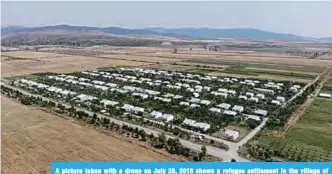  ??  ?? A picture taken with a drone on July 25, 2018 shows a refugee settlement in the village of Khurvaleti. —AFP