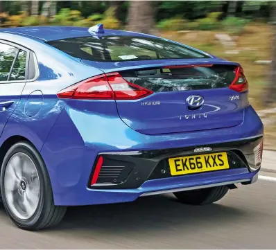  ??  ?? On the road SWITCH between electric and petrol power is a little jerky, but the Ioniq’s ride is comfortabl­e most of the time. Boot is seven litres up on the Prius’s; batteries are fitted under the back bench, so rear space is maximised