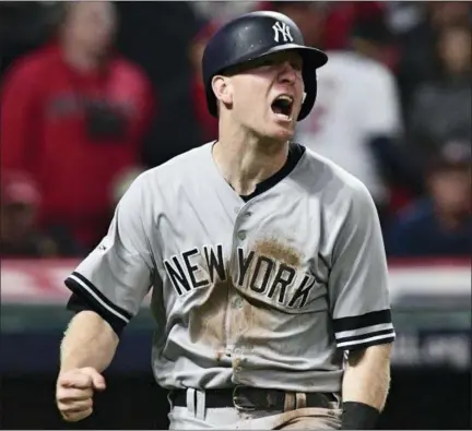  ?? DAVID DERMER — THE ASSOCIATED PRESS FILE ?? In this Wednesday file photo, New York Yankees’ Todd Frazier celebrates after scoring in the ninth inning against the Cleveland Indians in Game 5of a baseball American League Division Series, in Cleveland. On Monday a person familiar with the deal...